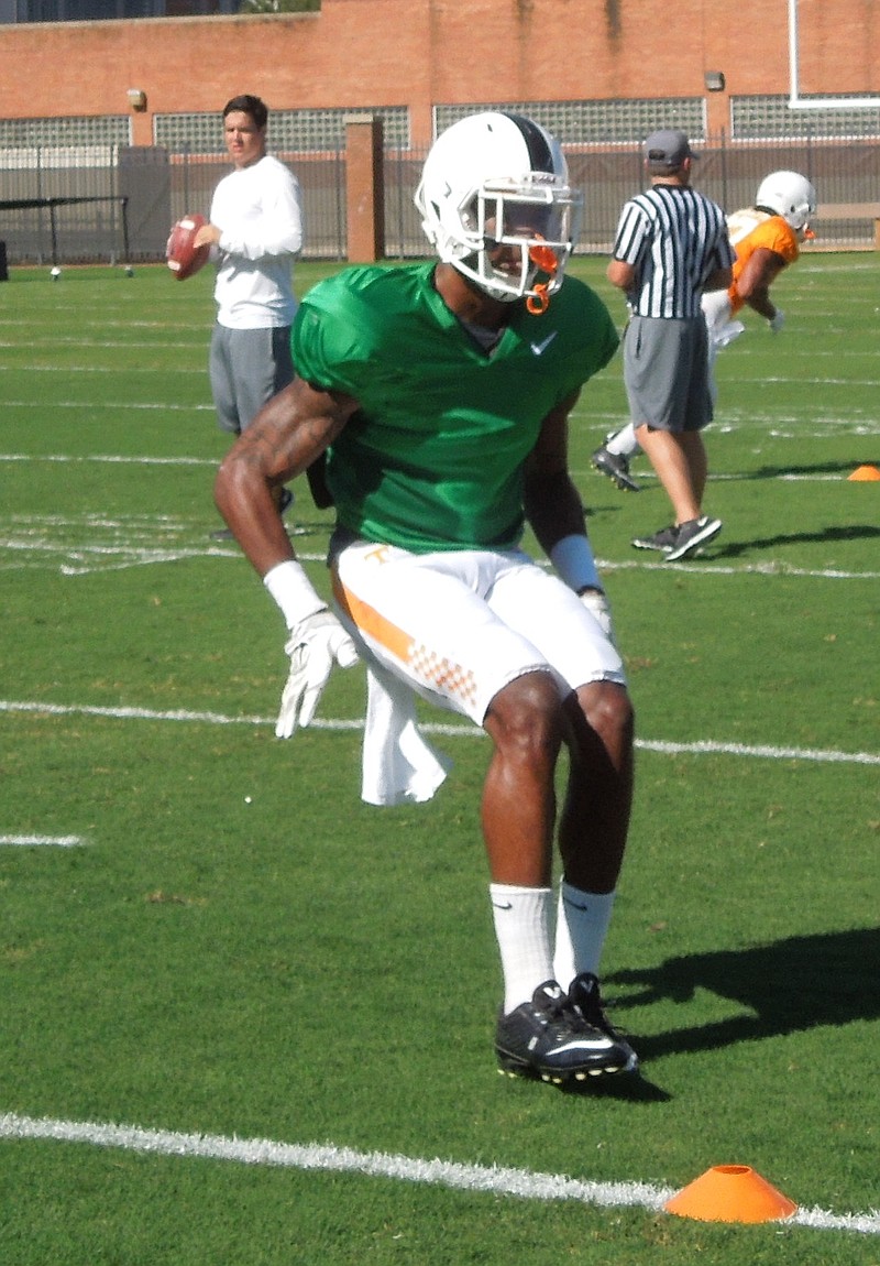 Cornerback Justin Martin goes through a drill during Tennessee's football practice at Haslam Field on Aug. 25, 2015.