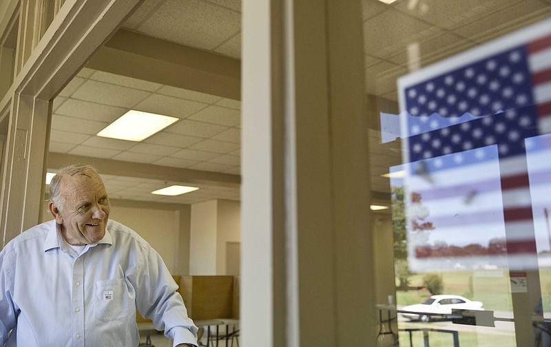 Talladega Mayor Larry Barton walks out of the voting booth during an election Tuesday, Aug. 25, 2015, in Talladega, Ala.