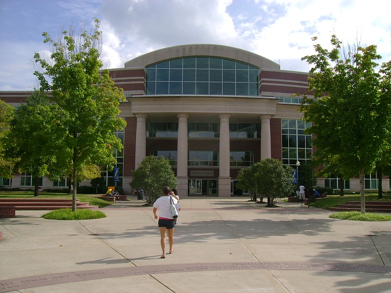 A student walks toward James E. Walker Library at Middle Tennessee State University.