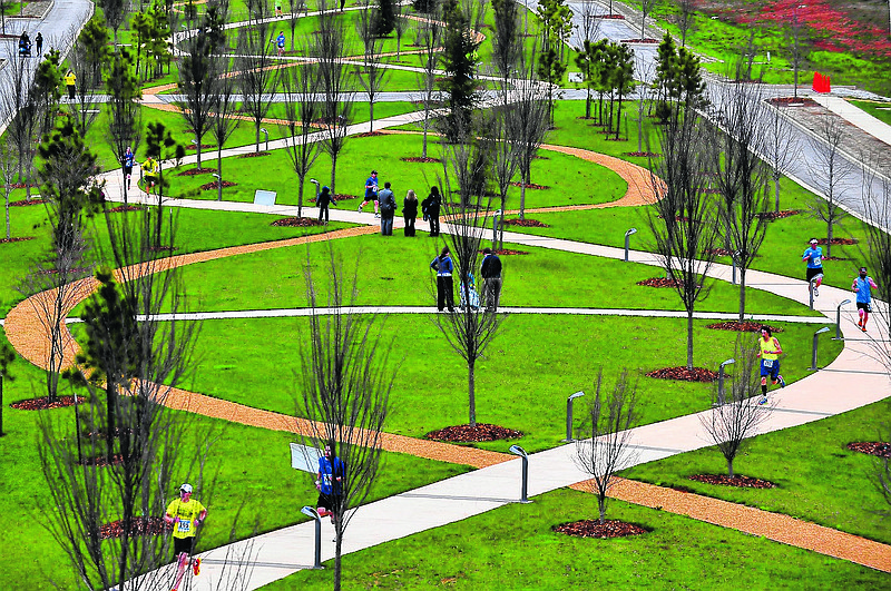 Runners participate in the 2013 HudsonAlpha Double Helix Dash through research park and on the research facility's double helix walkway in Huntsville, Ala., Tuesday, April 2, 2013.  (AP Photo/AL.com, Eric Schultz)