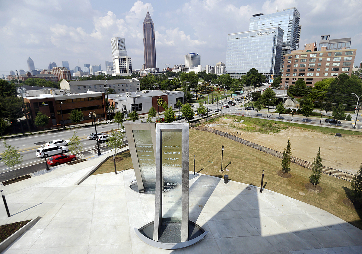 In this June 16, 2014 photo, quotes by former South African President Nelson Mandela and cultural anthropologist Margaret Mead decorate two water fountains outside the newly built National Center for Civil and Human Rights in Atlanta. The new museum about the history of civil rights opens next week in Atlanta, the city where Martin Luther King Jr. was based. But the National Center for Civil and Human Rights also explores other human rights struggles, from womenís rights and LGBT issues to immigration and child labor. The museum devotes separate galleries to modern human rights issues and the U.S. civil rights movement of the 1950s and ë60s, but also demonstrates how the two struggles are related. Visitors learn history through interactive exhibits and stories of real people. (AP Photo/David Goldman)