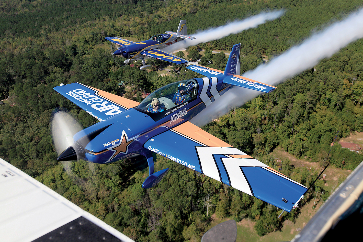 Staff Photo by Dan Henry/Chattanooga Times Free Press - 9/26/12. LTC John Klatt of the Air National Guard Aerobatic Team and Mike Goulian with Goodyear Aviation practice flying in formation on September 26, 2012, over Rome, Georgia's Richard B. Russell Regional Airport, in preparation for this weekend's Wings Over North Georgia Air Show. LTC Klatt had passenger Mary Beth Ritch fly with him as he practiced the maneuvers.
