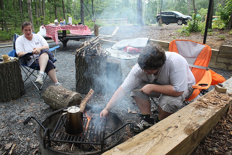 Joshua Bowen heats up coffee for his mother, Cynthia Bowen on Wednesday before having lunch at the Yurt Village in Cloudland Canyon. The Dalton residents are enjoying a few days of mother-son bonding on one of Lookout Mountain's many scenic areas.