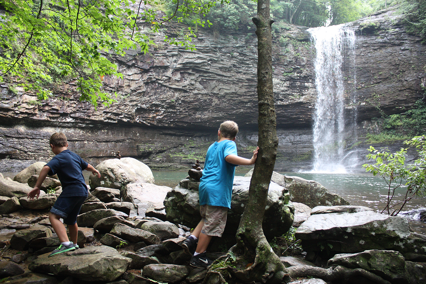 8-year-old twins, Joshua (right) and Jacob (left) Schenk explore the shore area by one of Cloudland Canyon's waterfalls while taking a scenic break from hiking Wednesday. The Palm Beach Fla. residents travelled with their parents, Steve and Lisa, to the area for sights like this