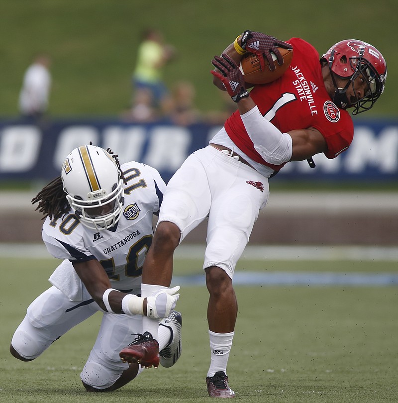 UTC defensive back Tavon Lawson tackles Jacksonville State cornerback Rashod Byers during the Mocs' home football game against the Gamecocks on Saturday, Sept. 6, 2014, at Finley Stadium in Chattanooga, Tenn. 