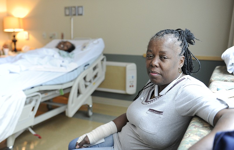 
              ADVANCE FOR USE FRIDAY, AUG. 28, 2015 AND THEREAFTER - Chevelle Washington, right, sits in the hospital room of her sister, Chelette Price, in Houston on Thursday, Aug. 13, 2015. One profound change wrought by Hurricane Katrina was the splitting of families as a mass evacuation from chaotic New Orleans sent thousands, including Washington's family, to the safety of other cities. (AP Photo/Pat Sullivan)
            