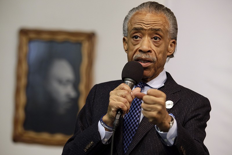
              FILE - In this May 2, 2015 file photo, a portrait of the Rev. Dr. Martin Luther King Jr. hangs on the wall behind the Rev. Al Sharpton as he speaks during a rally at the National Action Network, in New York. Sharpton is losing his daily show on MSNBC, with the network saying Wednesday, Aug. 26, 2015, that he’ll be downshifted to the weekend. Sharpton’s “Politics Nation” aired on weeknights at 6 p.m. EDT for the past four years at the ratings-challenged news network  (AP Photo/Mary Altaffer, File)
            