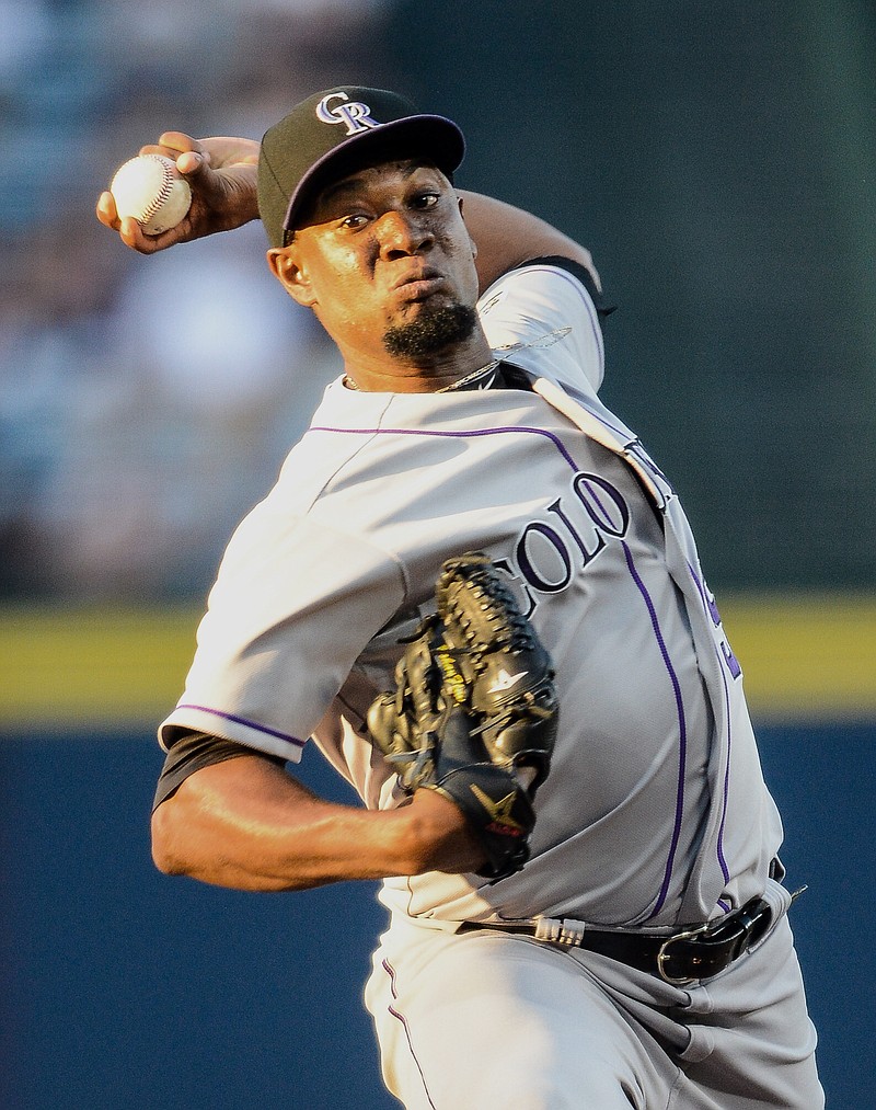 Colorado Rockies starting pitcher Yohan Flande works in the first inning of a baseball game against the Atlanta Braves, Wednesday, Aug. 26, 2015, in Atlanta. 