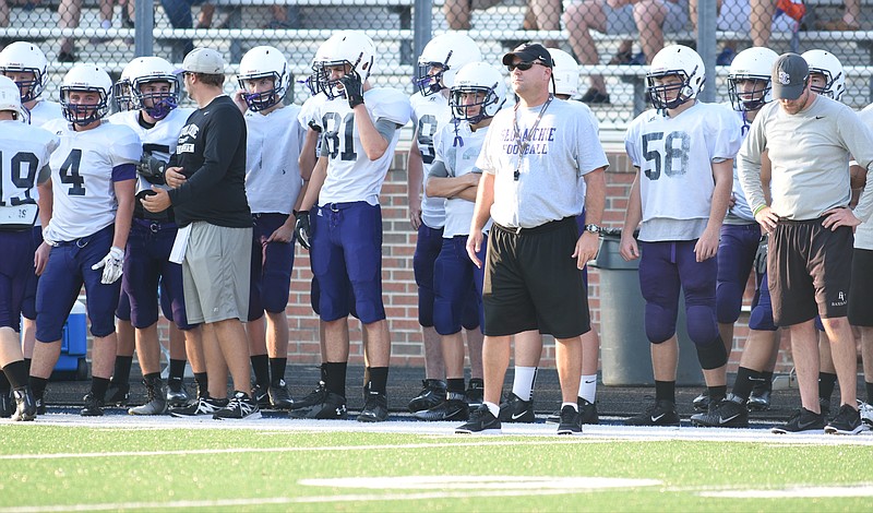 Sequatchie County head coach Adam Caine watches his men during a pre-season scrimmage at Gordon Lee on August 11, 2015.