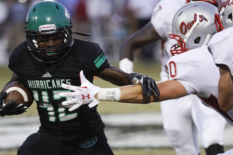 Staff Photo by Dan Henry / The Chattanooga Times Free Press- 9/19/14. East Hamilton‚Äôs David Whiteside (#42) runs the ball during the first half of play between the  Hurricanes and Owls at East Hamilton‚Äôs home field on September 19, 2014. 