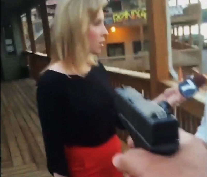 In this framegrab from video posted on Bryce Williams Twitter account and Facebook page, Williams, whose real name is Vester Lee Flanagan II, aims a gun at television reporter Alison Parker as she conducts a live on-air interview Wednesday in Moneta, Va. Moments later, Flanagan fatally shot Parker and WDBJ-TV cameraman Adam Ward and injured Vicki Gardner, who was being interviewed. The station said Flanagan was also a former employee at WDBJ and appeared on air as Bryce Williams. Flanagan posted his own video on Twitter. (Twitter via AP)