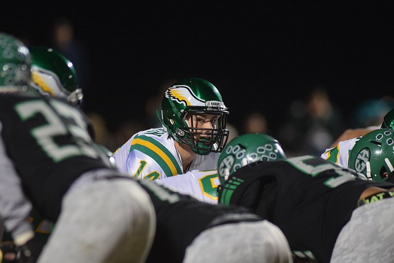 Golden Eagle quarterback Daniel Dotson (14) calls the signals.  The Rhea County Golden Eagles visited the East Hamilton Hurricanes Friday night in TSSAA football action.