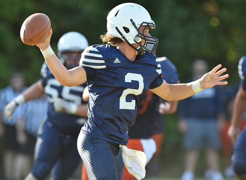 Soddy-Daisy quarterback Justine Cooke (2) rolls out to pass.  Five area high schools scrimmaged at Bradley Central High School Saturday, August 1, 2015.