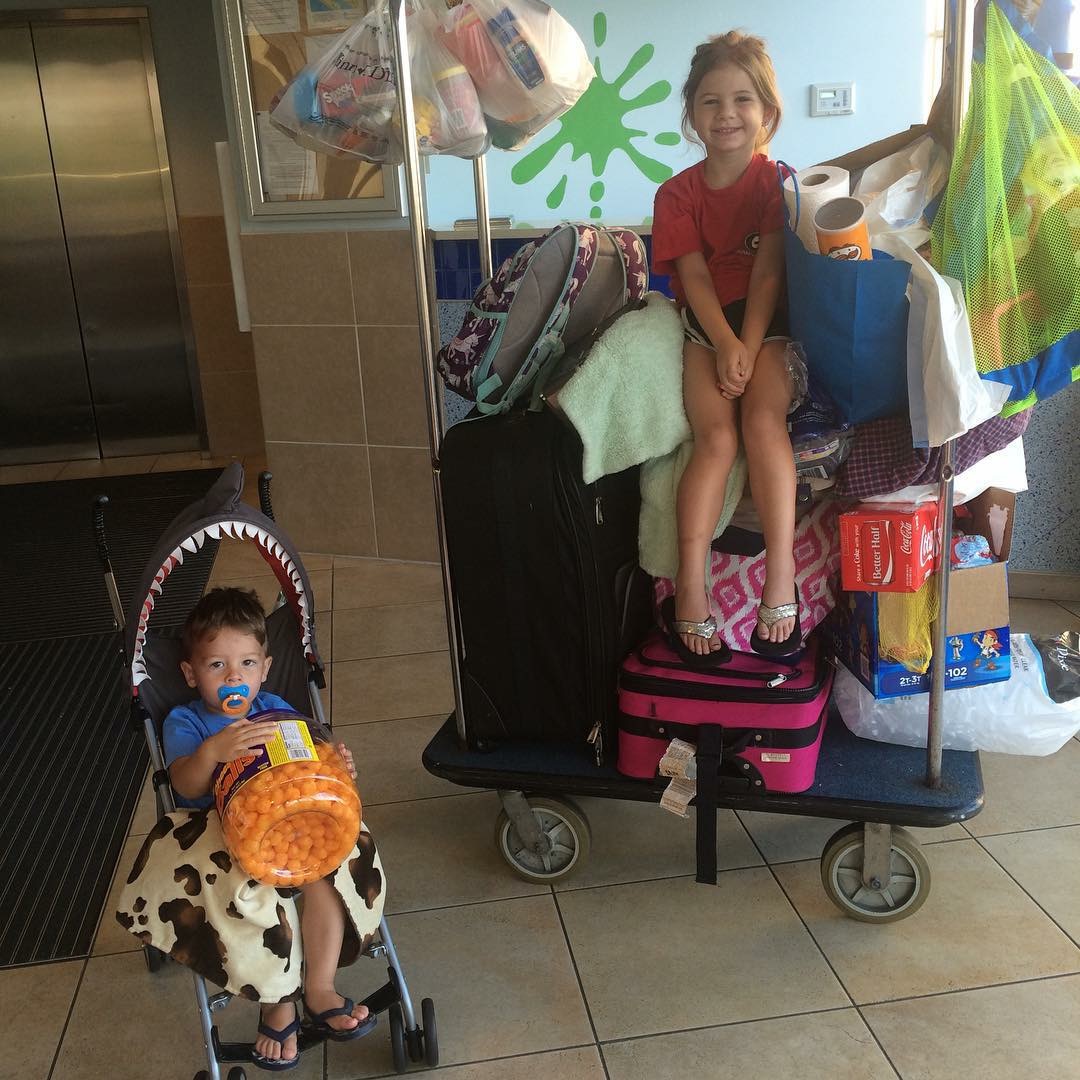 Packed up, Brooks Reed, 2, is making sure the cheese balls aren't left behind in Panama City Beach as the family heads home to Chatsworth, Ga. His sister, Emmie, is just all smiles.