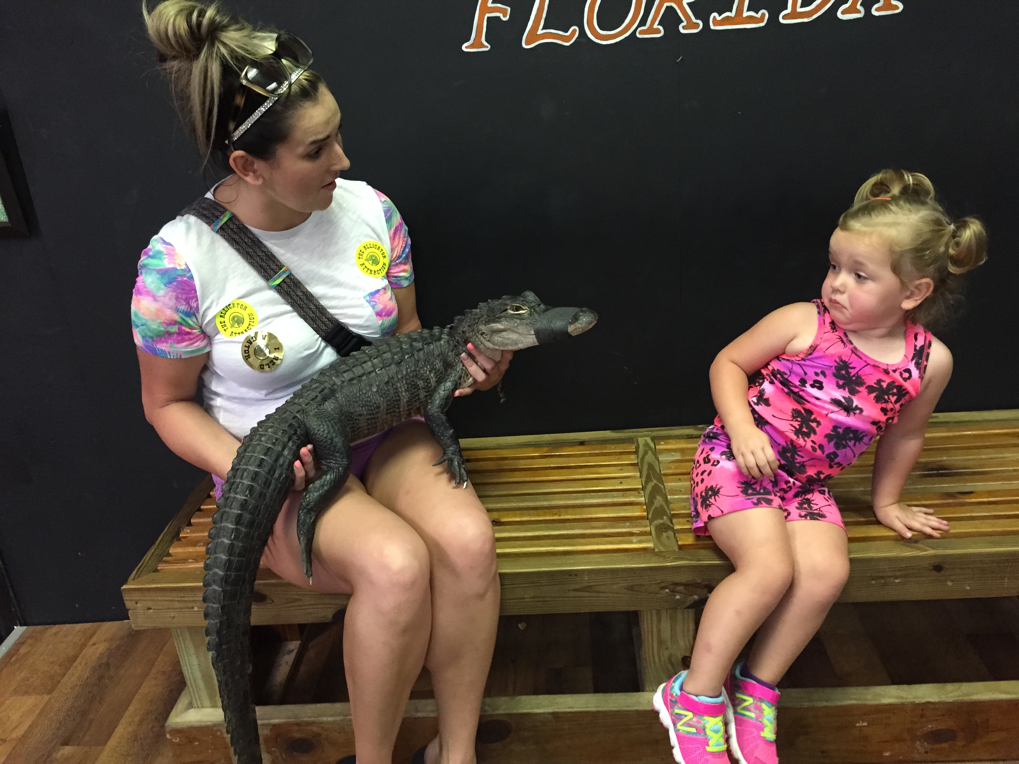 During a trip to St. Petersburg, Fla., Olivia Huff, 2, has little interest in getting up close and personal with what she calls a "wallygator."