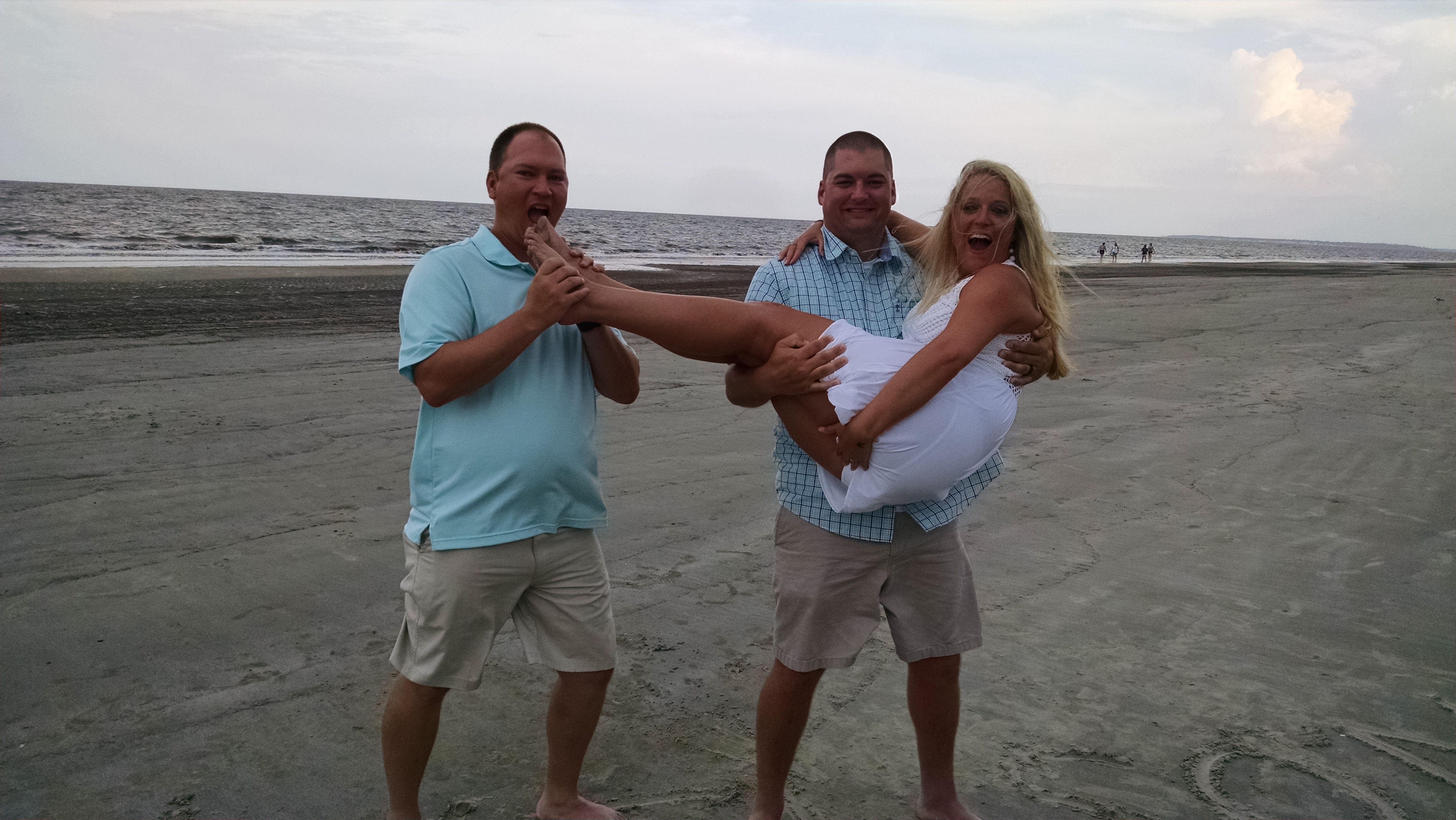 Steve Wilson's three adult children, from left, Adam, Ryan and Katie, being silly the last day at the beach. Katie is afraid her 