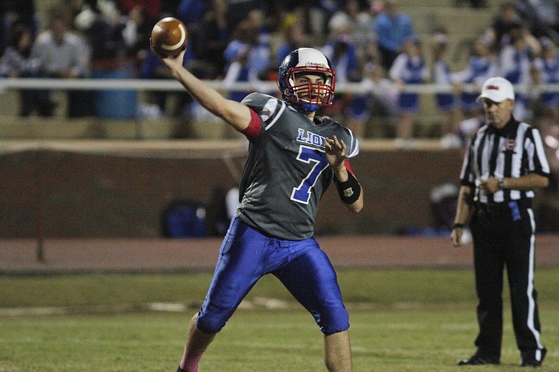 Photo by Dan Henry / The Chattanooga Times Free Press- 10/17/14. Red Bank High School's Caleb Tate (7) passes while playing Hixson High School during the first half of play at the Lion's home field Friday evening. 