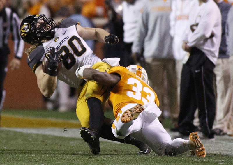 Tennessee defensive back LaDarrell McNeil (33) tackles Missouri tight end Sean Culkin during the Vols' football game against the Missouri Tigers on Saturday, Nov. 22, 2014, at Neyland Stadium in Knoxville, Tenn.