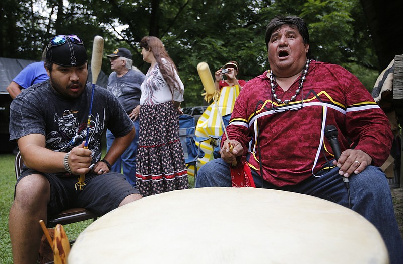 Ammons Rattler, left, and Rick Bird play a drum and sing during a dance demonstration in August 2014 at the Cherokee Heritage Festival at Red Clay State Park in Cleveland, Tenn. Today, the park will host a tri-council meeting of the Cherokee that will bring the three federally recognized tribes together at Red Clay for the first time.