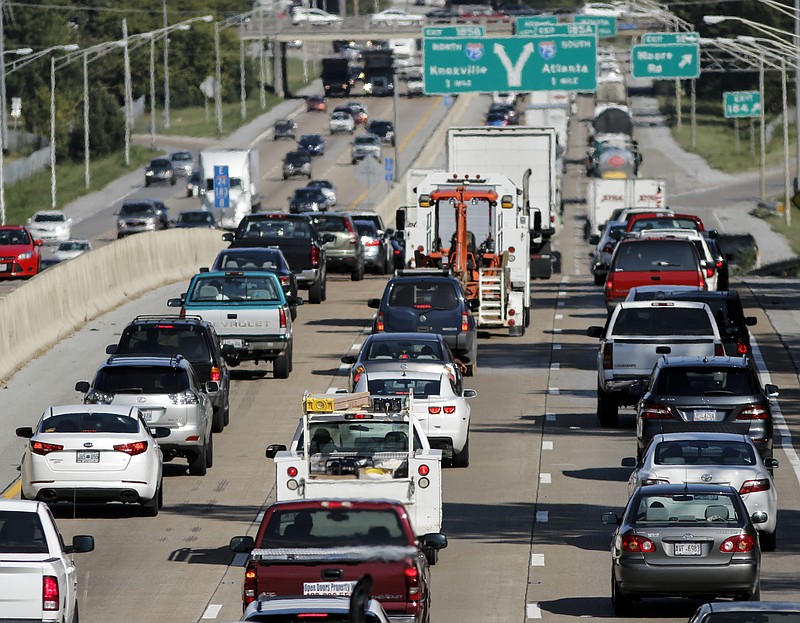 Vehicles travel in rush-hour traffic on Interstate 24 on Wednesday, Aug. 26, 2015, in Chattanooga, Tenn. The average driver in the U.S. loses 42 hours a year in traffic, according to a transportation report released Wednesday, and population growth over the next 30 years is projected to cause more traffic congestion.