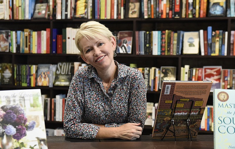 Owner Star Lowe is photographed at Star Line Books on Thursday, Aug. 27, 2015, in Chattanooga, Tenn. Star Line Books, located in the building at the corner of Main and Market Streets, opens for business on Friday. 