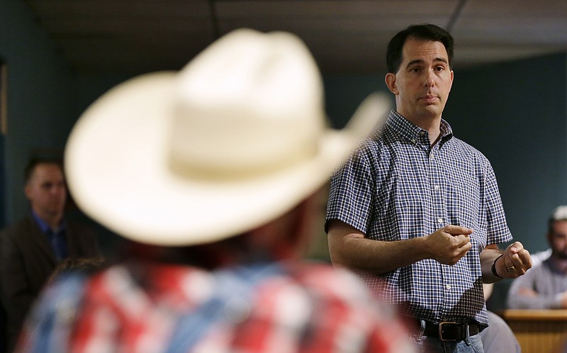 
              Republican presidential candidate, Wisconsin Gov. Scott Walker ,speaks during a meet and greet with local residents, Thursday, Aug. 27, 2015, in Guthrie Center, Iowa. (AP Photo/Charlie Neibergall)
            