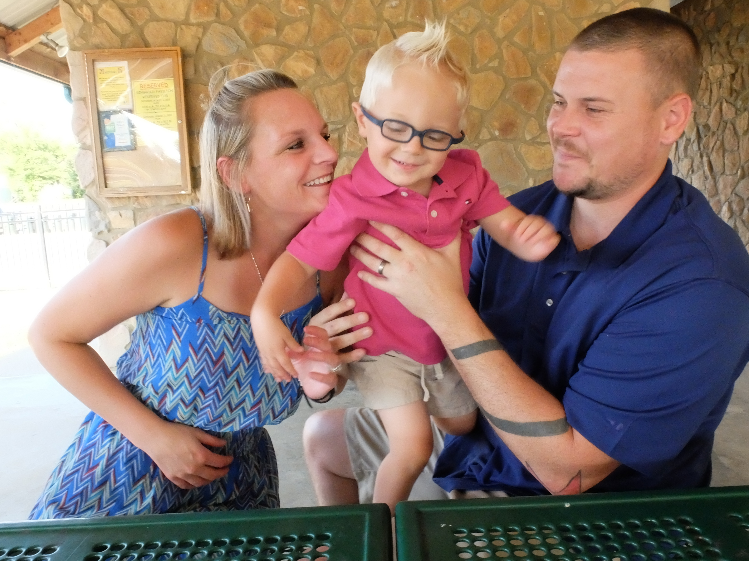 Chance Hall, center, 2, enjoys a warm moment with his parents, Amy Hall, left, and Nolan Hall.