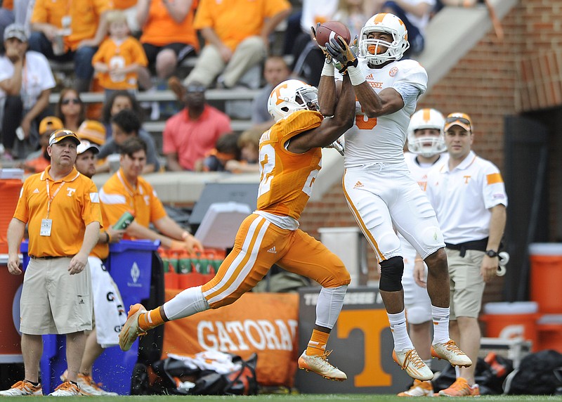 Tennessee defensive back Malik Foreman (22) breaks up a pass intended for wide receiver Josh Malone (3) during the NCAA college football team's Orange & White game at Neyland Stadium on Saturday, April 25, 2015, in Knoxville, Tenn. (Adam Lau/Knoxville News Sentinel via AP)