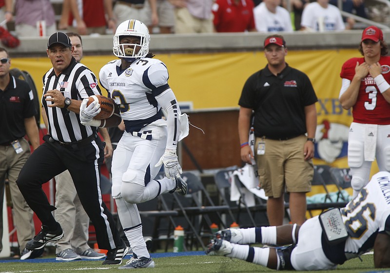 UTC defensive back Dee Virgin runs the ball in for a touchdown after intercepting it during the Mocs' home football game against the Jacksonville State Gamecocks on Saturday, Sept. 6, 2014, at Finley Stadium in Chattanooga, Tenn. 