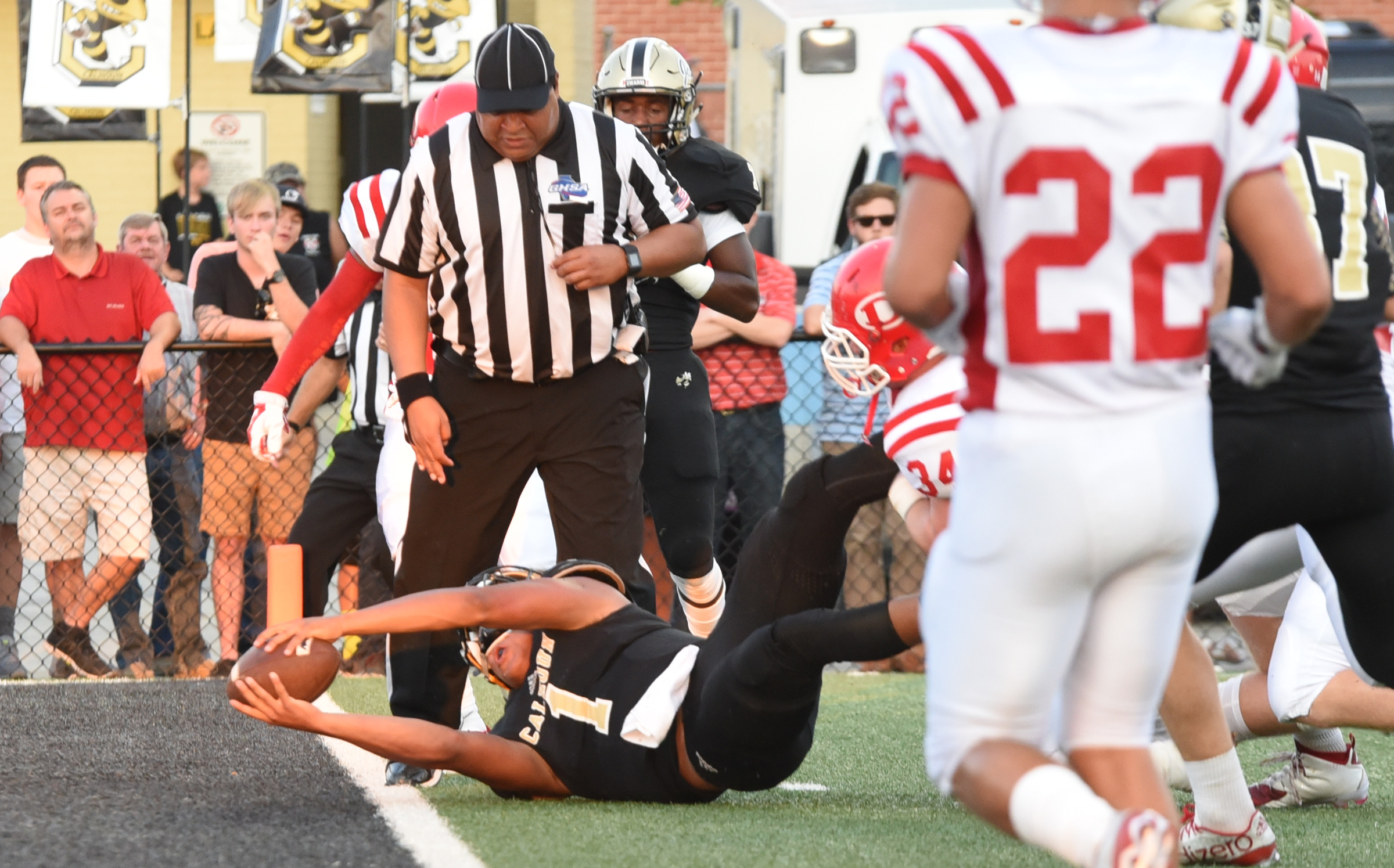 Calhoun quarterback Kaelan Riley (1) stretches for the second touchdown of the first quarter against the Dalton Catamounts Friday night at home.