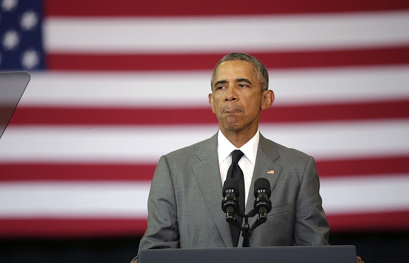 
              President Barack Obama pauses as he delivers remarks at an event commemorating the tenth anniversary of Hurricane Katrina in New Orleans, Thursday, Aug. 27, 2015. (AP Photo/Gerald Herbert)
            