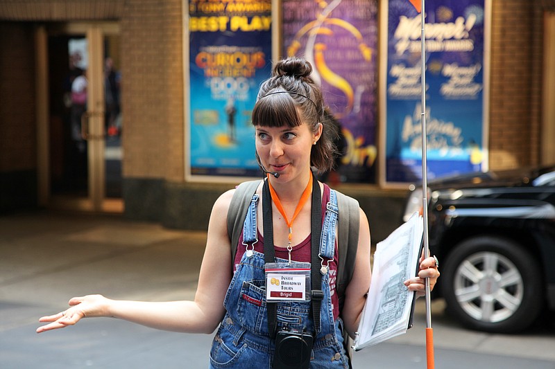 Inside Broadway Tour guide Brigid Kegel tells visitors about the history of Shubert Alley near Times Square in New York In this July 28, 2015 photo.