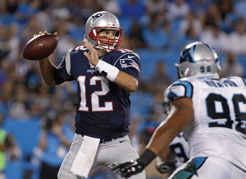 
              New England Patriots quarterback Tom Brady (12) looks to pass under pressure from Carolina Panthers' Wes Horton (96) during the first half of a preseason NFL football game in Charlotte, N.C., Friday, Aug. 28, 2015. (AP Photo/Bob Leverone)
            