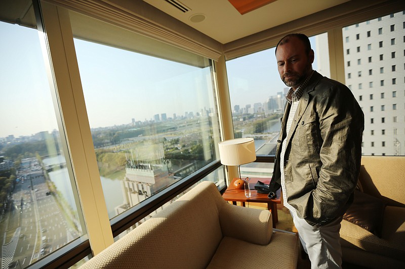 
              FILE - In this Tuesday, April 1, 2014, file photo, Noel Biderman, chief executive of Avid Life Media Inc., which operates AshleyMadison.com., poses by a hotel room window overlooking the Imperial Palace grounds during a photo session in Tokyo. Biderman is stepping down in the wake of the massive breach of the company’s computer systems and outing of millions of its members, Avid Life Media announced, Friday, Aug. 28, 2015. (AP Photo/Eugene Hoshiko, File)
            