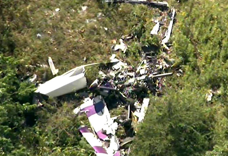 This image taken from video and provided by WABC/abc7NY.com, shows the wreckage of a stunt plane from the air of WABC TV's NewsCopter7 as it flies near Stuart Air Force Base in New Windsor, N.Y., Friday, Aug. 28, 2015. A pilot was killed after his propeller-driven stunt plane crashed while he was practicing tricks for a weekend air show in New York's Hudson Valley, state police said Friday. (WABC/abc7NY.com via AP)