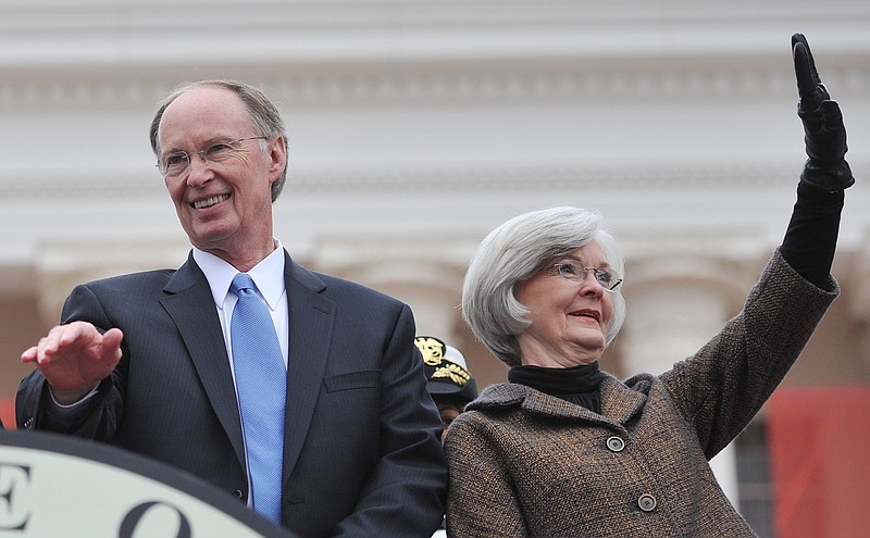 Robert Bentley and his wife Dianne wave to supporters during inaugural ceremonies at the Alabama Capitol 