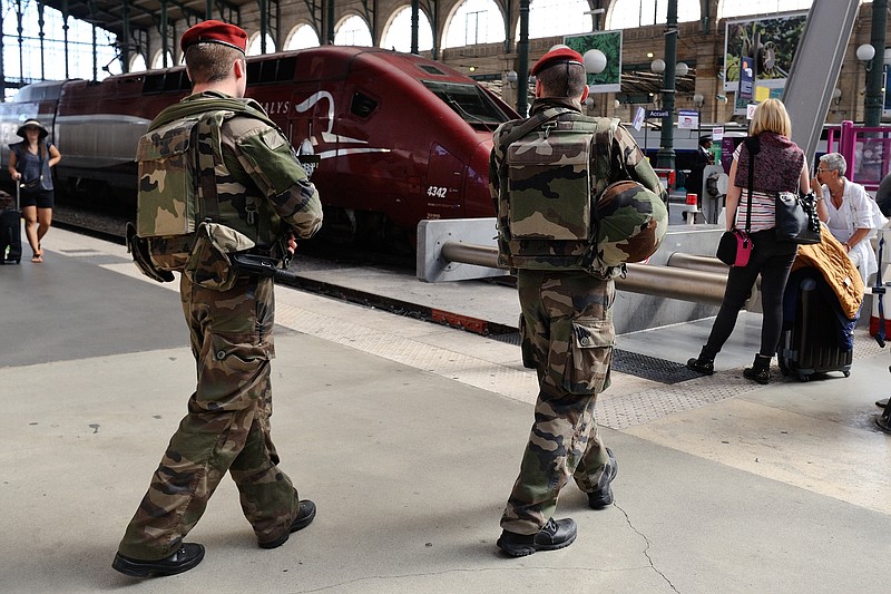 
              FILE - In this Aug .22 2015 file photo, French soldiers patrol at Gare du Nord train station in Paris, France. The attack Aug. 21 on the Thalys train from Amsterdam to Paris happened at the height of the summer travel season. France hosts emergency talks in Paris on Saturday, with representatives from other high-speed international rail nations, Belgium, Britain, Germany, Italy, Luxembourg, the Netherlands, Spain and Switzerland.  (AP Photo/Binta, File)
            