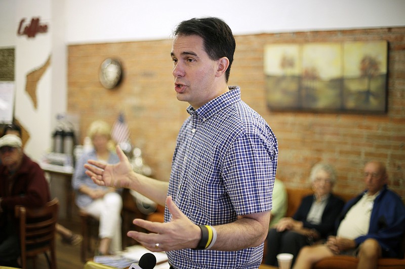 
              Republican presidential candidate, Wisconsin Gov. Scott Walker speaks during a meet and greet with local residents, Thursday, Aug. 27, 2015, in Greenfield, Iowa. (AP Photo/Charlie Neibergall)
            