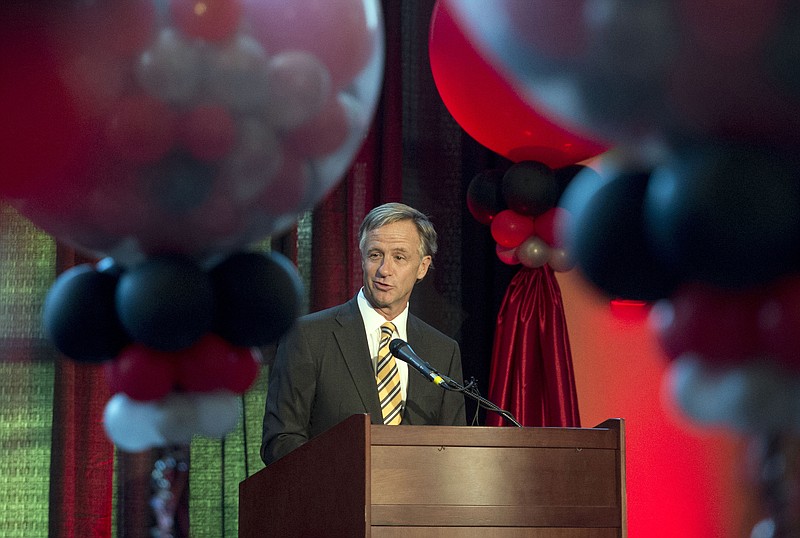 Gov. Bill Haslam speaks with guests in Maryville, Tenn., on Tuesday, Aug. 25, 2015, during Denso Manufacturing's 25th anniversary of operating in Tennessee.