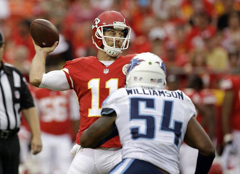 Kansas City Chiefs quarterback Alex Smith (11) throws under pressure from Tennessee Titans linebacker Avery Williamson (54) during the first half of a preseason NFL football game at Arrowhead Stadium in Kansas City, Mo., Friday, Aug. 28, 2015. 