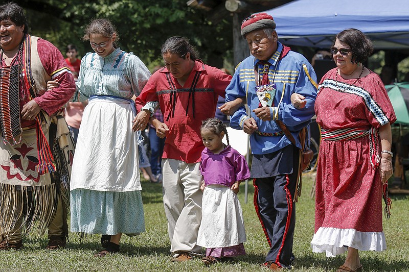Cherokee demonstrate a "Horse dance" at the Cherokee Heritage Festival at Red Clay State Park on Saturday, Aug. 29, 2015, in Cleveland, Tenn. The festival marks the first time since 1838 that the three federally recognized Cherokee tribes have met at the park.