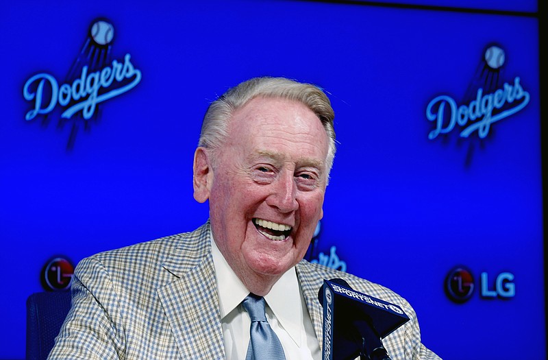 
              Los Angeles Dodgers Hall of Fame broadcaster Vin Scully announces he will return to broadcast his 67th, and last baseball season in 2016, during a news conference in Los Angeles, Saturday, Aug. 29, 2015. (AP Photo/Alex Gallardo)
            