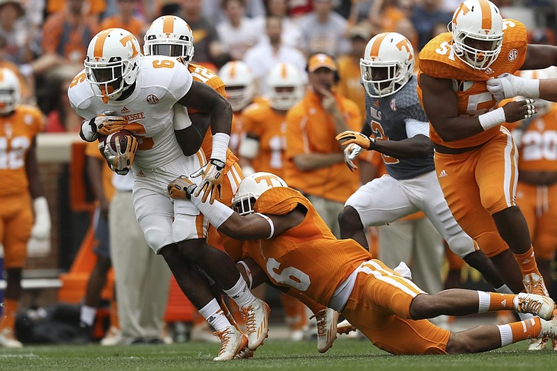 Tennessee running back Alvin Kamara tries to break free during the Volunteers' spring game. He's in Knoxville after redshirting at Alabama as a freshman in 2013 and playing junior college football last year.