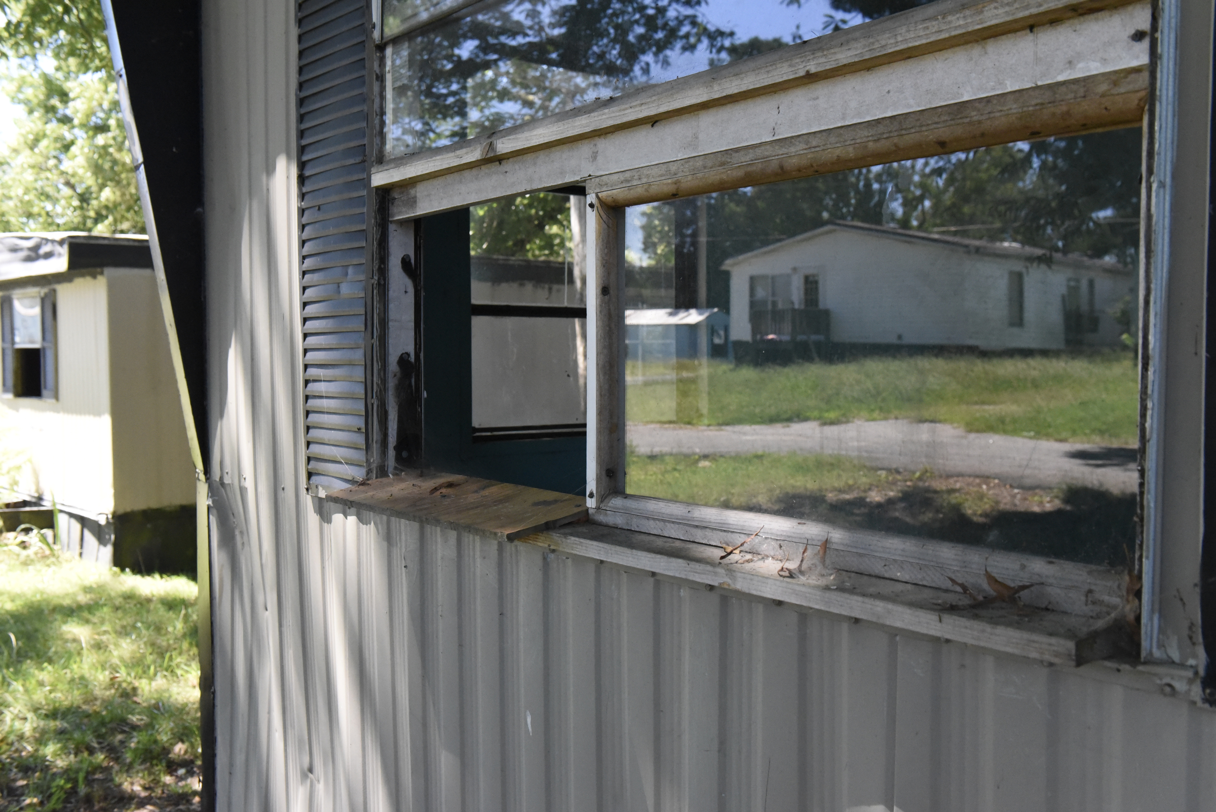 The Pear Pines Mobile Home Park, seen Tuesday, Aug. 25, 2015, in LaFayette, Ga., has few remaining residents after the landlord's financial problems caused water to be turned off at the property several weeks ago.