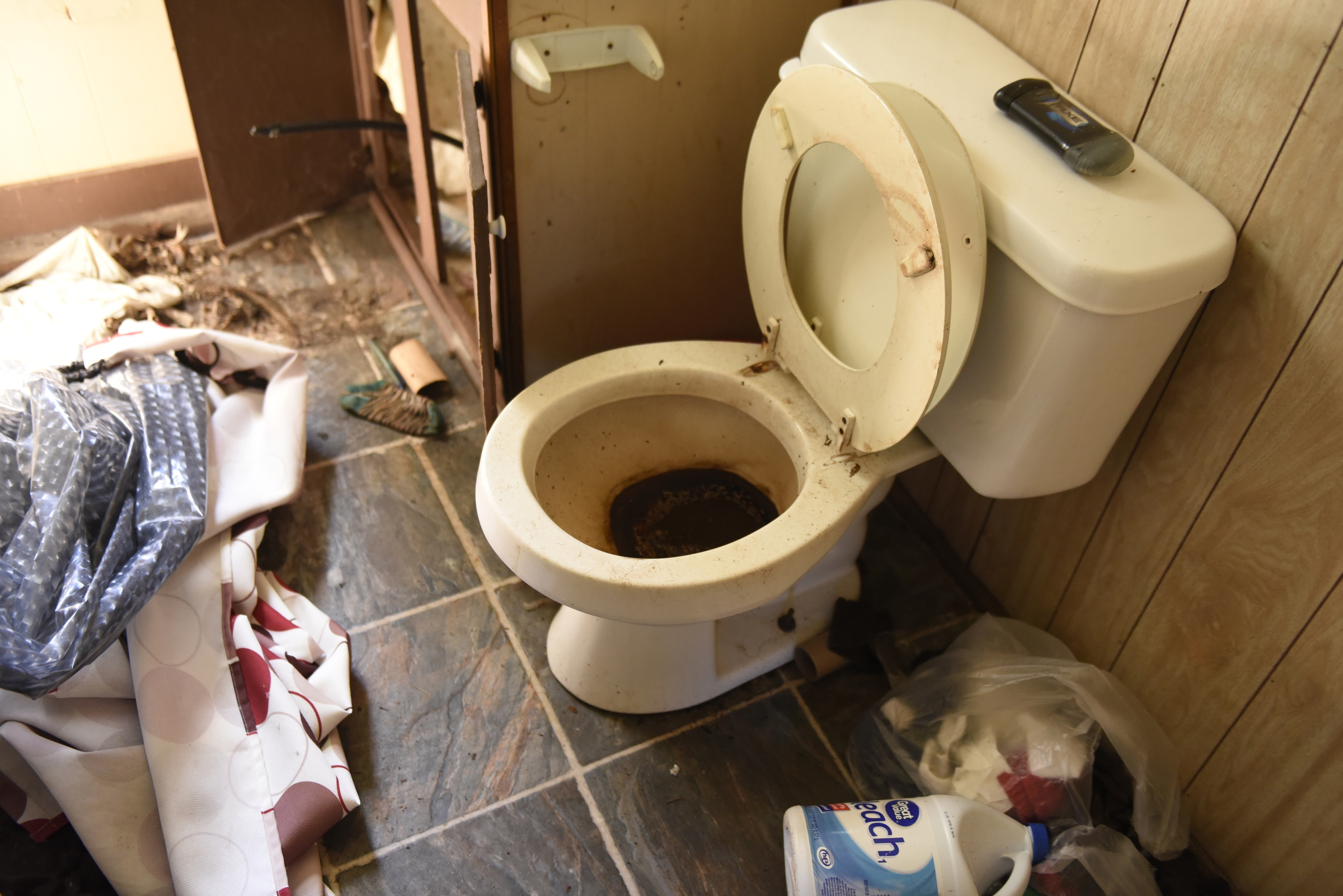 Disorder is seen inside this abandoned unit at the Pear Pines Mobile Home Park on Tuesday, Aug. 25, 2015, in LaFayette, Ga. Water has been turned off at the property for several weeks.