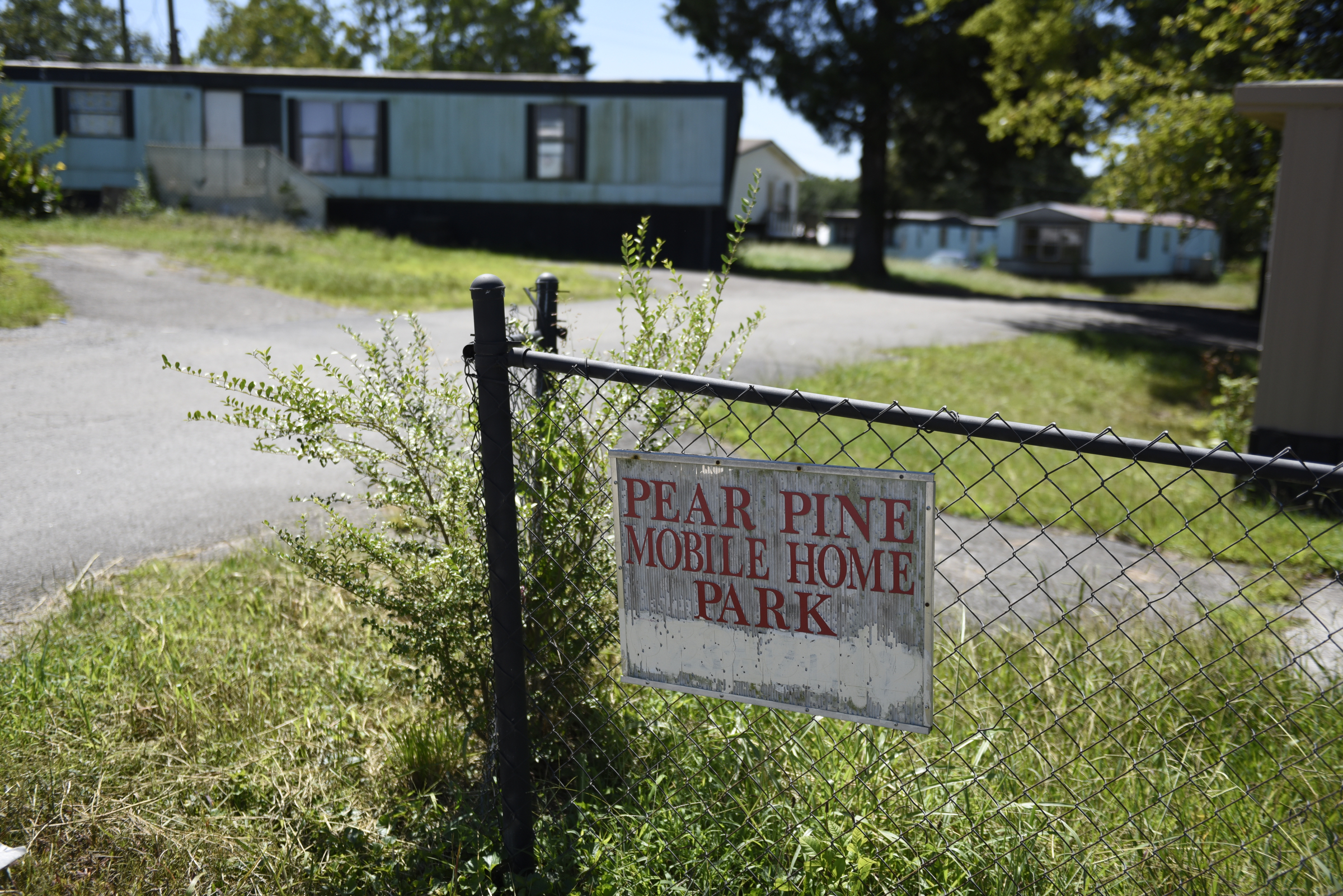 The Pear Pines Mobile Home Park, seen Tuesday, Aug. 25, 2015, in LaFayette, Ga., has few remaining residents after the landlord's financial problems caused water to be turned off at the property several weeks ago.
