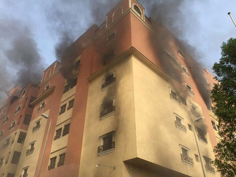 
              In this image released by the Saudi Interior Ministry’s General Directorate of Civil Defense, smoke billows from a fire at a residential complex used by state oil giant Saudi Aramco in Khobar, Saudi Arabia, Sunday, Aug. 30, 2015. Authorities say one person has been killed and dozens were injured in the fire. (Saudi Interior Ministry General Directorate of Civil Defense via AP)
            