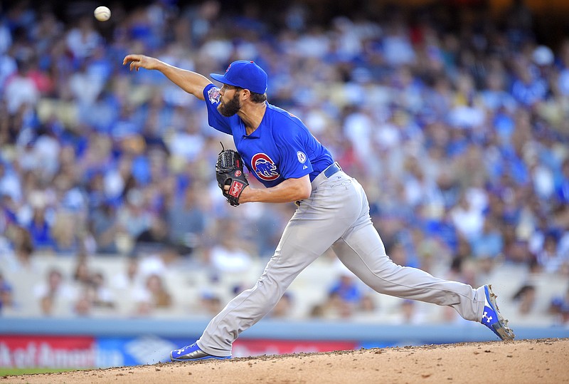 Chicago Cubs starting pitcher Jake Arrieta throws to the plate during the fifth inning of a baseball game against the Los Angeles Dodgers, Sunday, Aug. 30, 2015, in Los Angeles. 