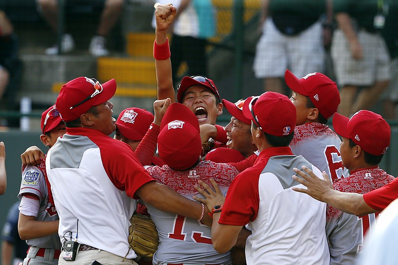 Japan celebrates after winning the Little League World Series Championship baseball game over Lewisberry, Pa. in South Williamsport, Pa., Sunday, Aug. 30, 2015. Japan won 18-11.