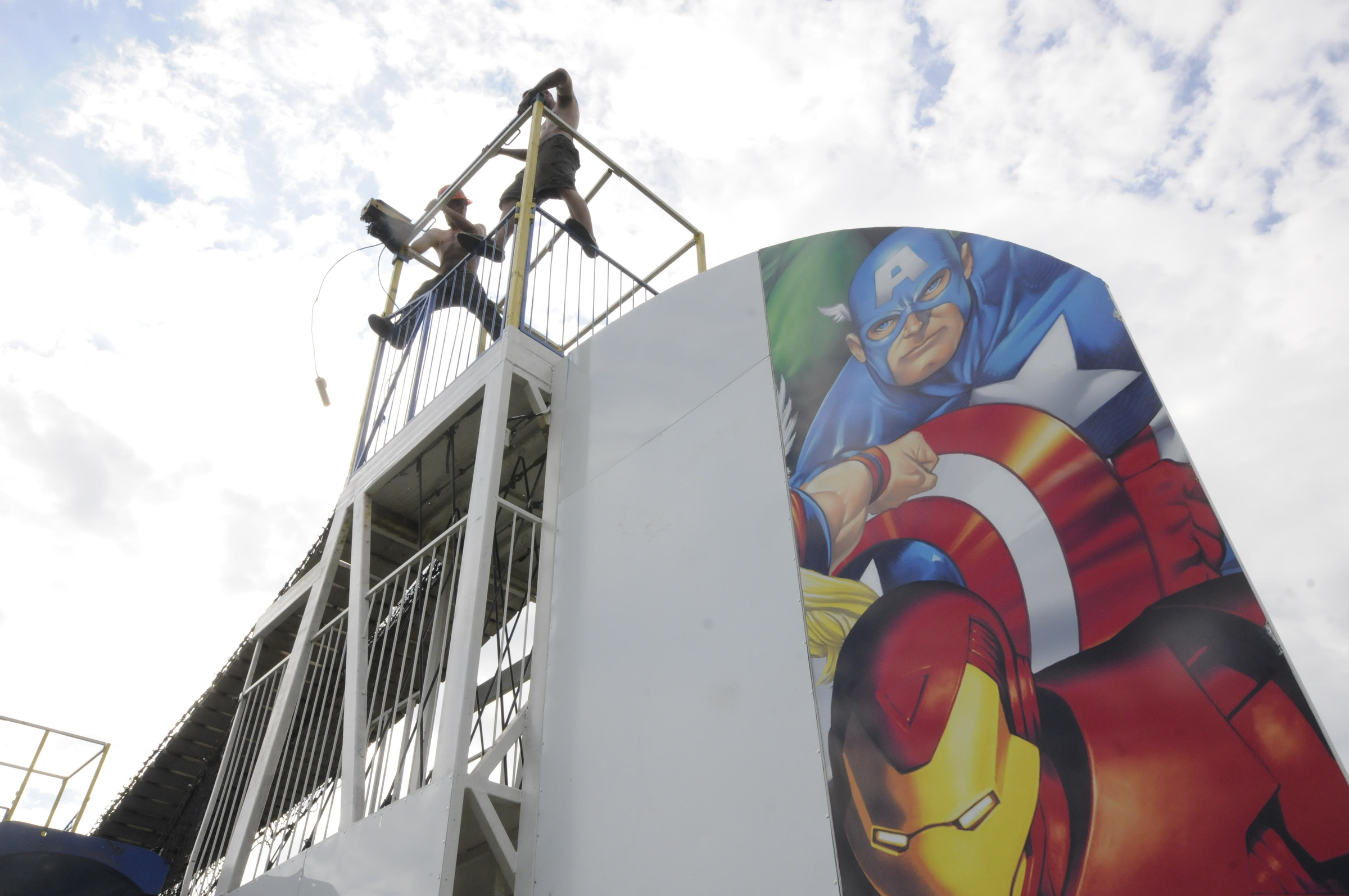 David Gleason, top left, and T.J. Wolosonowich work to assemble the Avengers 3-story funhouse Monday afternoon at the 88th Annual Sequatchie County Fair in Dunlap. The fair opens Wednesday and runs through Monday, Sept. 7.